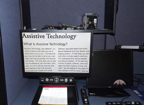 Desktop document magnifier with the words: Assistive Technology
